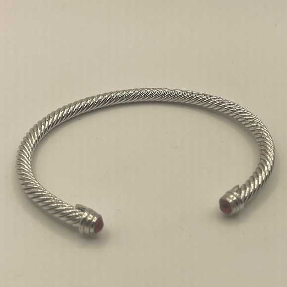 STERLING SILVER 925 CABLE CLASSIC BRACELET WITH RED GEMSTONE ENDS.